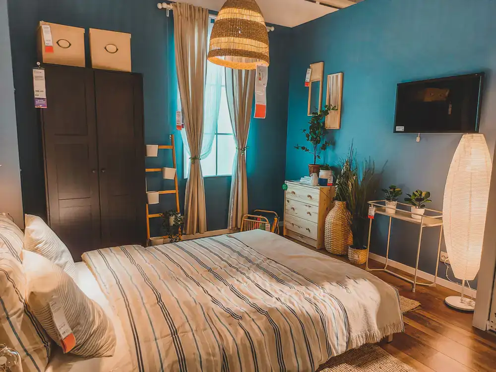 A calm, beautifully lit display of premium beds in the showroom