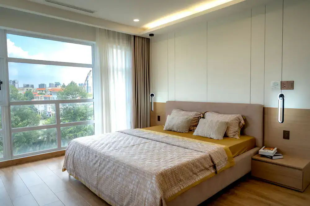 A solid wooden bed frame with clean minimalist lines